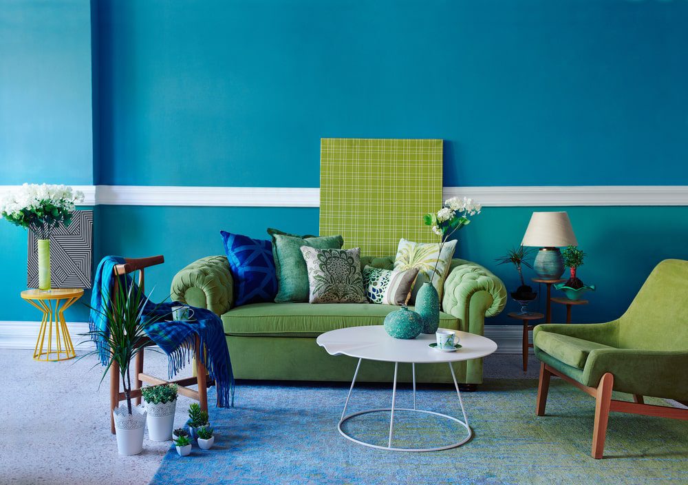 Interior painting project showcasing vibrant blue and green color scheme for a commercial space