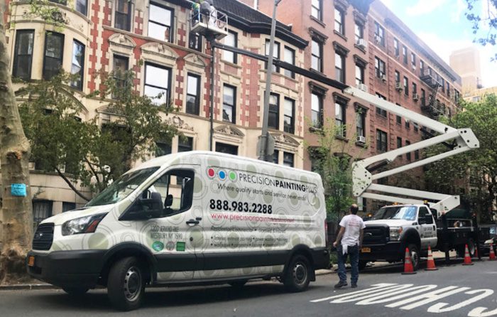 All Coast Painting, also known as Precision Painting Plus, van with a lift working